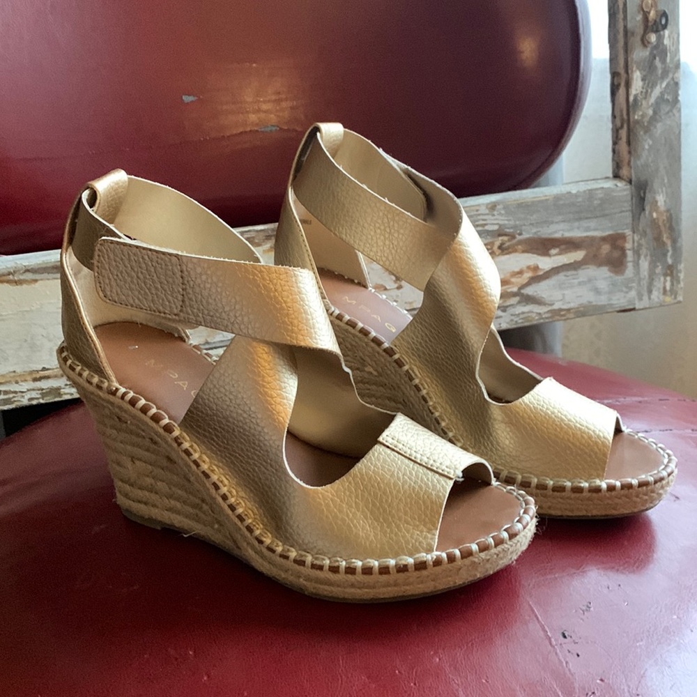 Gold leather wedge heel sandals.
